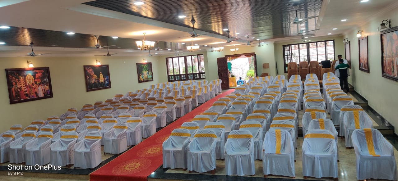 Seating arrangement with chair covers at Parijatha Conventional Hall